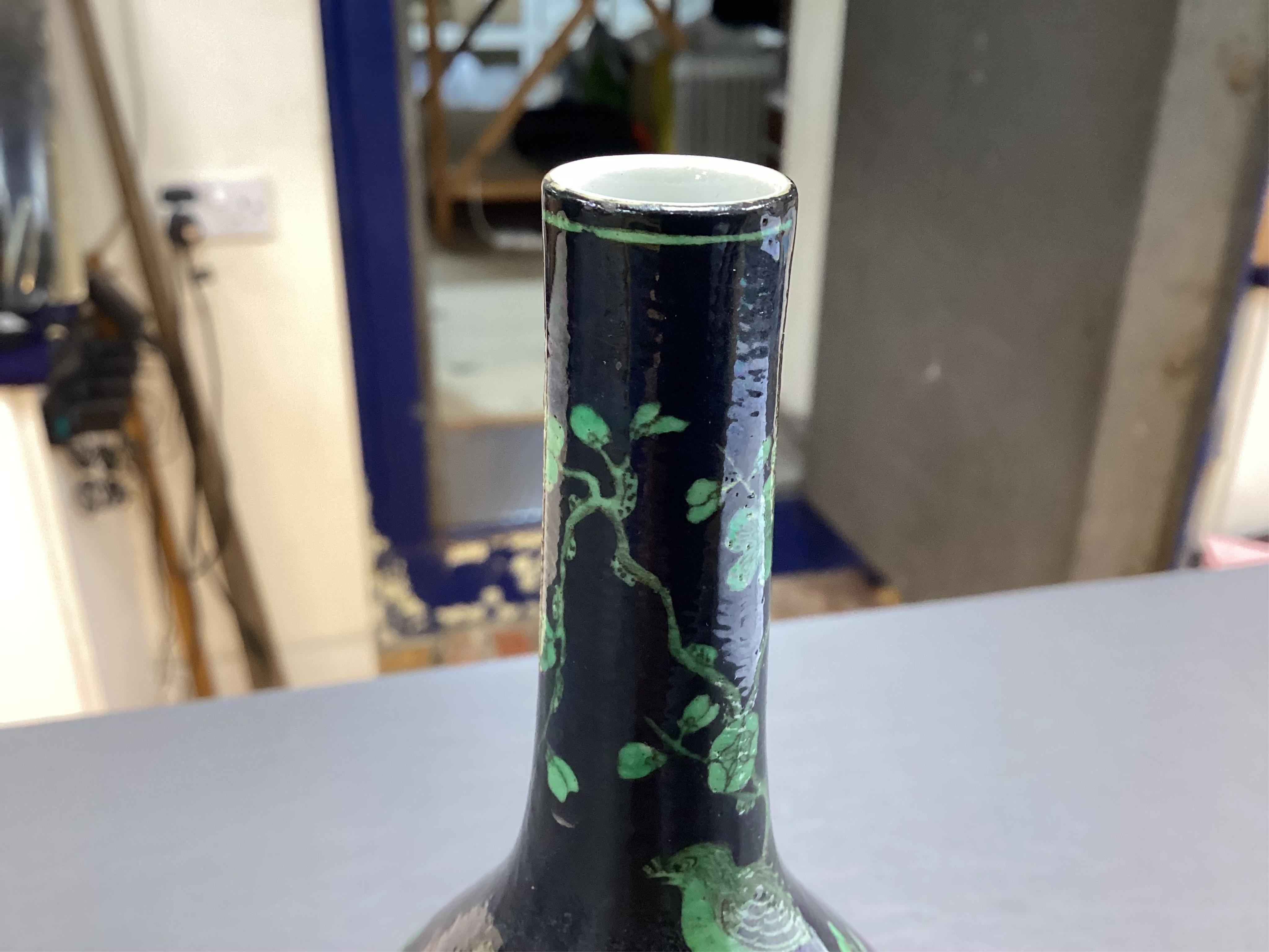 A Chinese famille noire bottle vase, 17cm high